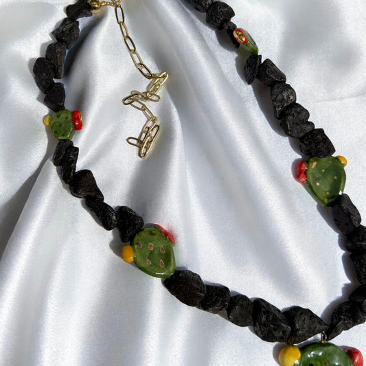 Handmade Sicilian necklace with Mount Etna lava stone, hand-painted Caltagirone ceramic prickly pear details and gold-tone extension chain
