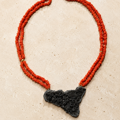 Full view of handmade Sicilian red coral necklace with Sicily-shaped Mount Etna lava stone pendant