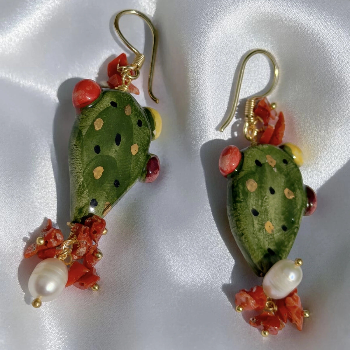 Pair of handmade Sicilian prickly pear earrings with hand-painted green Caltagirone ceramic, red coral and freshwater pearl details