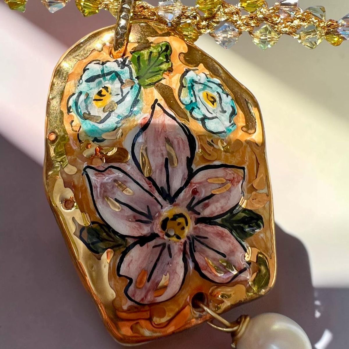 Hand-painted Caltagirone ceramic floral pendant with pearl on handmade Sicilian necklace