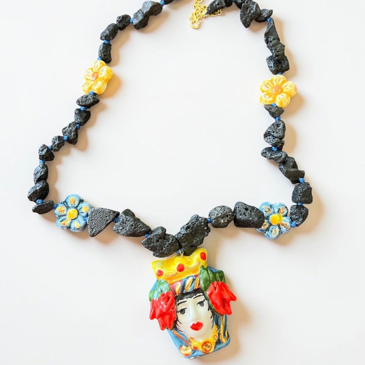 Handmade Sicilian jewelry necklace with Testa di Moro ceramic pendant, Etna lava stone and hand-painted ceramic flowers