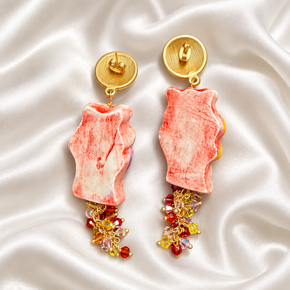 Back view of hand-painted Caltagirone ceramic Moor’s Head earrings in red and white with Swarovski crystals, gold-tone zamak studs and gold-plated brass details.